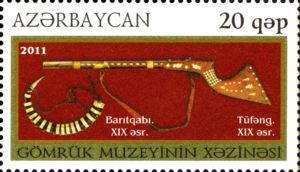 Rifle with Inlaid Stock and Powder Flask (XIX c.)