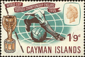 Footballer's legs, ball and Jules Rimet Cup