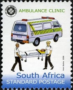 Ambulance, attendants moving patient on gurney