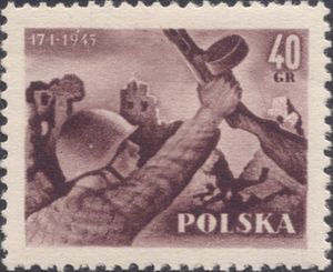 Soldier in front of ruins in Warsaw