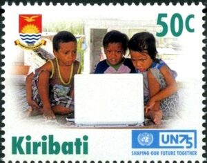 Children sit in front of a laptop