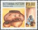 Kalanga Finished Pots and a Woman Forming a Pot