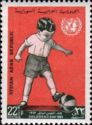 Boy Playing Ball and UN Emblem