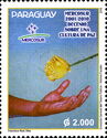 Hand reaching out for Yellow Rose