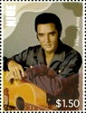 Elvis Presley with hands resting on guitar