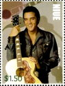 Elvis Presley holding guitar by neck