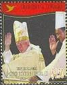 With Archbishop Pantin, Hands Raised in Blessing