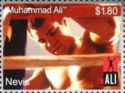 Muhammed Ali seated by ring ropes