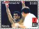 Muhammed Ali with arms raised in victory