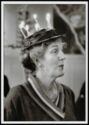 Portrait photo: elderly woman with 7 candles on her hat (happy birthday)