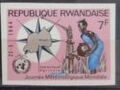 Map of Rwanda and Woman at Water Pump