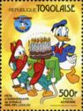 Huey, Dewey, Louie and Donald Duck with the birthday cake