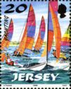 Hobie Cats with pink, purple and orange Sails