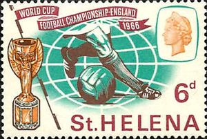 Footballer's legs, ball and Jules Rimet Cup