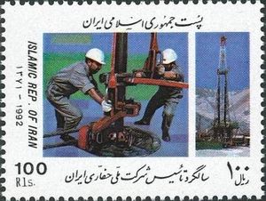 Workers Drilling and Drilling Rig