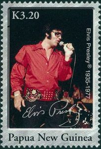 Elvis in red singing
