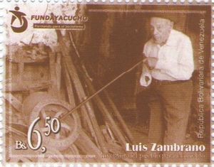 Luis Zambrano putting rod into a machine