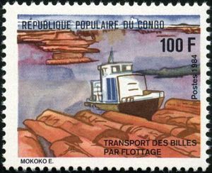 Tugboat pushing logs