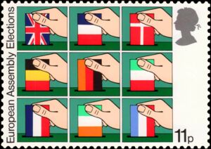 Hands placing National Flags in Ballot Boxes - 11p