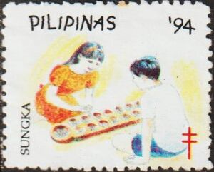 Tuberculosis Charity. Children Playing game called Sungka