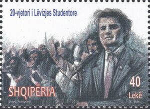 Protestors, man at microphone