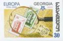 Magnifying Glass and First Europa Stamps