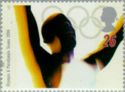 Athlete celebrating and Olympic Rings