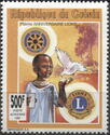 Child, dove, Rotary and Lions Clubs emblems