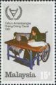 Girl in wheelchair using Sewing Machine