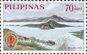 Volcano in Lake Taal and Malaria Eradication Emblem