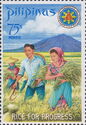 President and Mrs. Marcos harvesting miracle rice