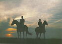 Horsemen at sunset