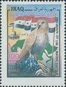 Falcon (Falcus sp.) tears Flag of the USA; Flag of Iraq; Dom
