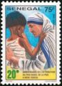 Mother Teresa Pinches Child's Cheek