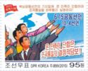Three people with outstretched arms, flag with Korean Penin…