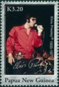 Elvis in red singing