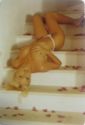 Blonde Woman Laying on the Stairs