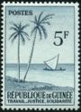Palm trees and dhow (sailing ship)
