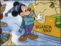 Mickey Mouse loading a sack of toys on the sleigh
