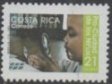 Child Examining Stamp