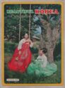 Two women in traditional costumes and a swing in the tree