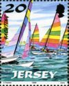 Hobie Cat with white, yellow, red and green Sails