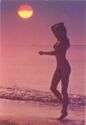 Nude Woman on sea side at sunset